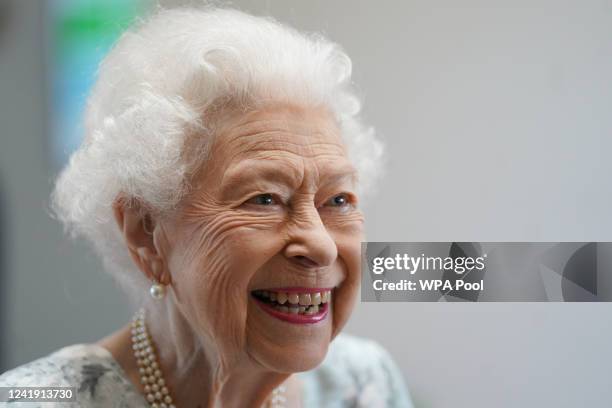 Queen Elizabeth II smiles during a visit to officially open the new building at Thames Hospice on July 15, 2022 in Maidenhead, England.