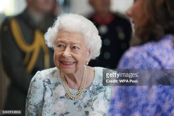 Queen Elizabeth II smiles during a visit to officially open the new building at Thames Hospice on July 15, 2022 in Maidenhead, England.
