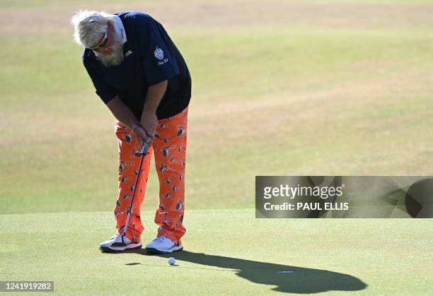 Golfer John Daly putts on the 18th green during his second round on day 2 of The 150th British Open Golf Championship on The Old Course at St Andrews...