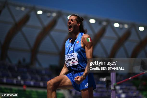 Italy's Gianmarco Tamberi reacts after qualifying in the men's high jump qualification during the World Athletics Championships at Hayward Field in...