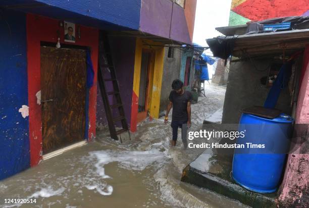 Arabian Sea waves lash the houses close to the seashore during high tide amid heavy rainfall at Bandstand, Bandra, on July 14, 2022 in Mumbai, India.