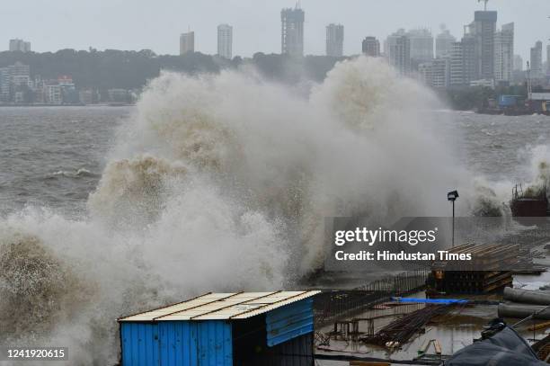 Arabian Sea waves crash ashore during high tide amid heavy rainfall at Marine Drive, on July 15, 2022 in Mumbai, India.