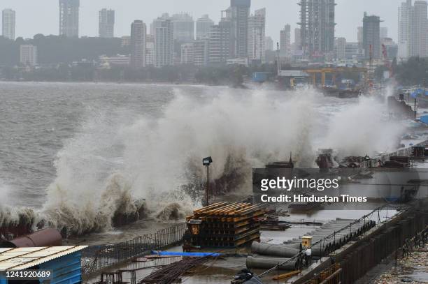 Arabian Sea waves crash ashore during high tide amid heavy rainfall at Marine Drive, on July 15, 2022 in Mumbai, India.