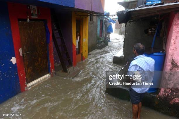 Arabian Sea waves lash the houses close to the seashore during high tide amid heavy rainfall at Bandstand, Bandra, on July 14, 2022 in Mumbai, India.