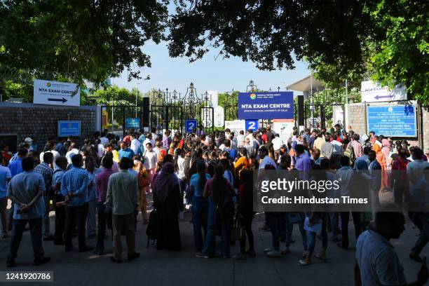 Students arrive to appear for the first slot of Common University Entrance Test for undergraduate admissions at North campus on July 15, 2022 in New...