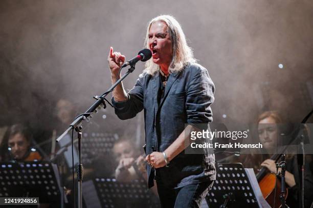 Singer Justin Sullivan of the British band New Model Army performs live on stage during a concert with the Orchestra Sinfonia Leipzig at the...