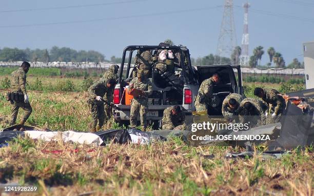 Soldiers of the Mexican Army work at the site of a Navy helicopter crash near the airport of Los Mochis, Sinaloa State, Mexico on July 15, 2022. -...