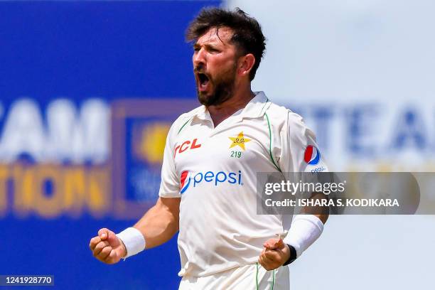 Pakistans Yasir Shah celebrates after taking the wicket of Sri Lanka's Kusal Mendis during the first day of the first cricket Test match between Sri...