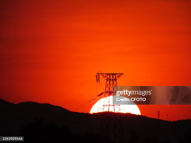 Power grid at sunset in Yichang, Hubei Province, China, July 14, 2022. From January to June 2022, China's electricity consumption increased by 2.9...