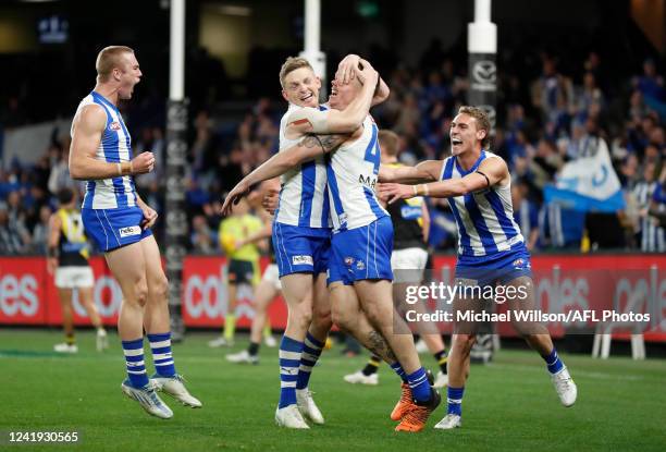 Cameron Zurhaar of the Kangaroos celebrates a goal during the 2022 AFL Round 18 match between the North Melbourne Kangaroos and the Richmond Tigers...