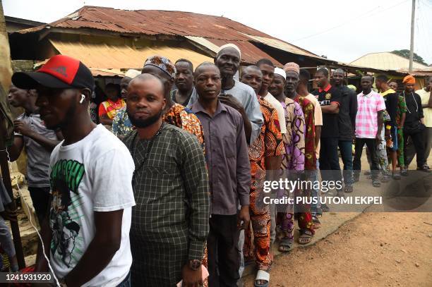 Voters queue to vote at a polling station during the gubernatorial election at Ede in Osun State, southwest Nigeria, on July 16, 2022. - Voters went...