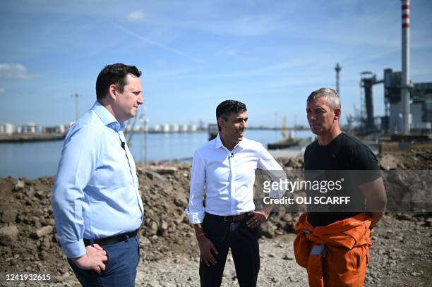 Conservative MP and Britain's former Chancellor of the Exchequer, Rishi Sunak , and Tees Valley Mayor Ben Houchen talk with Martin Corney, a director...