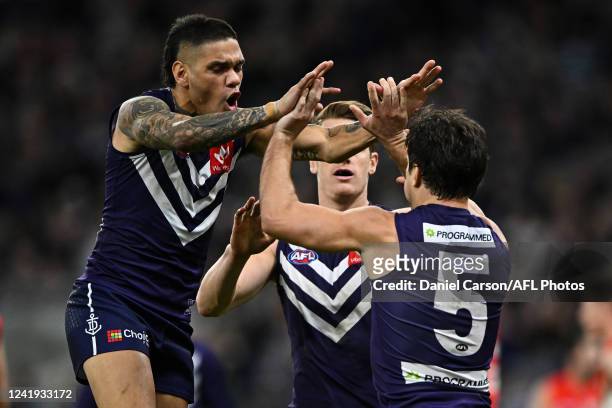 Lachie Schultz and Michael Walters of the Dockers celebrates a goal during the 2022 AFL Round 18 match between the Fremantle Dockers and the Sydney...