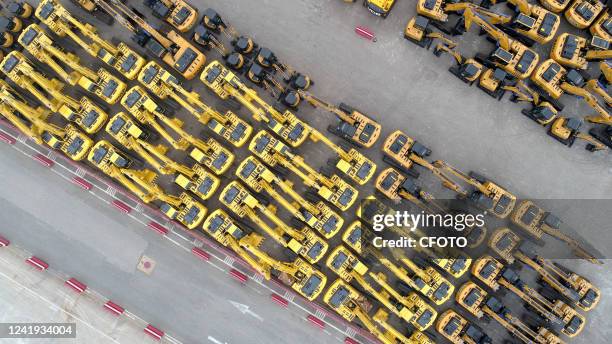 Nearly 200 chinese-made construction vehicles are loaded at Qingdao Port for shipment to Russia under the supervision of Huangdao Border Inspection...