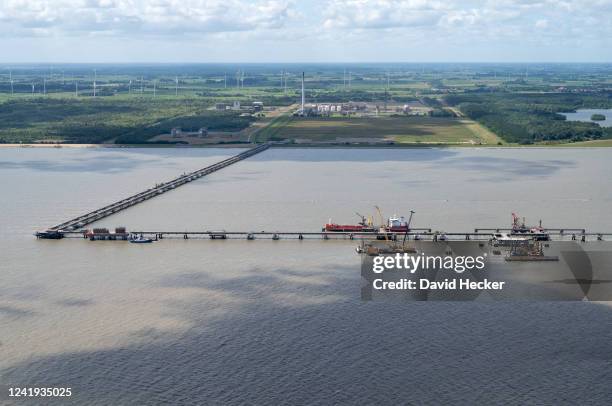 In this view from an airplane a terminal for connecting floating stations for liquified natural gas stands under construction on July16, 2022 near...