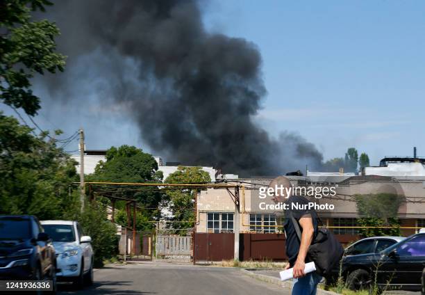 The cloud of the smoke from the fire seen after a rocket strike on a trade and production warehouse, amid Russia's invasion of Ukraine, in Odesa,...
