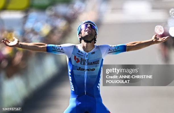 Team Bikeexchange-Jayco team's Australian rider Michael Matthews celebrates as he cycles to the finish line to win the 14th stage of the 109th...