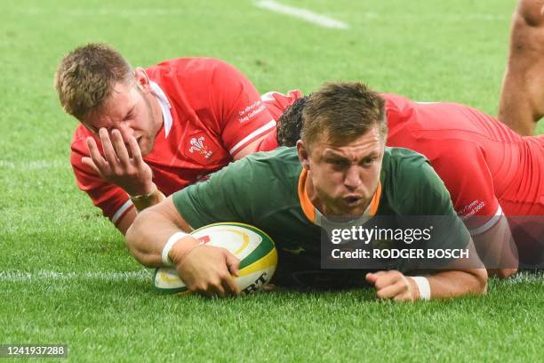 South Africa's fly-half Handre Pollard scores a try during an international rugby union match between South Africa and Wales at the Cape Town Stadium...