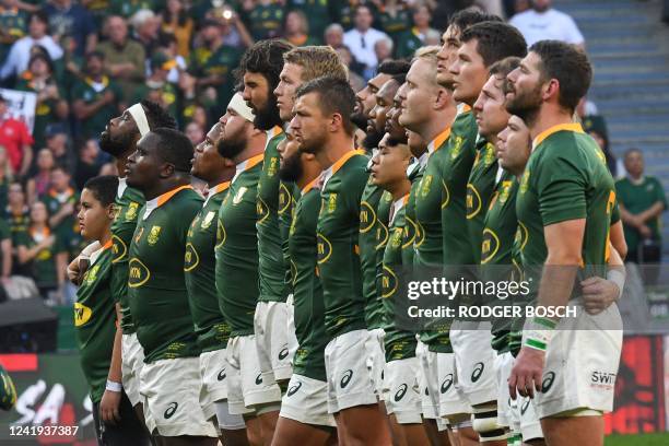 South Afdrican rugby players sing their national anthem ahead of the international rugby union match between South Africa and Wales at the Cape Town...