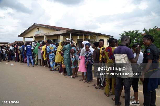 Voters queue to vote as counting of ballots start at a polling station during the gubernatorial election in Osogbo, Osun State in southwest Nigeria,...