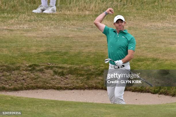 Northern Ireland's Rory McIlroy celebrates after holing a bunker shot for an eagle on the 10th hole during his third round on day 3 of The 150th...