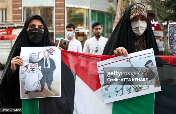 Iranian students from the Islamic Basij volunteer militia protest in the capital Tehran, on July 16 2022, against the US President's visits to Israel...