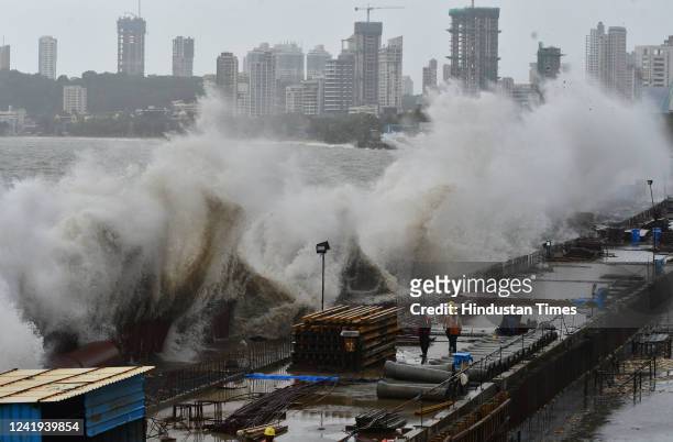 Arabian Sea waves lash the seashore on the coastal road construction site during high tide amid rain showers and cloudy weather at Marine Drive, on...