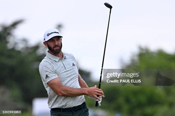 Golfer Dustin Johnson watches his drive from the 18th tee during his third round on day 3 of The 150th British Open Golf Championship on The Old...