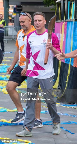 Antony Cotton takes part in The Queen's Baton Relay as part of the Birmingham 2022 Queens Baton Relay on July 16, 2022 in Bolton, England. The...