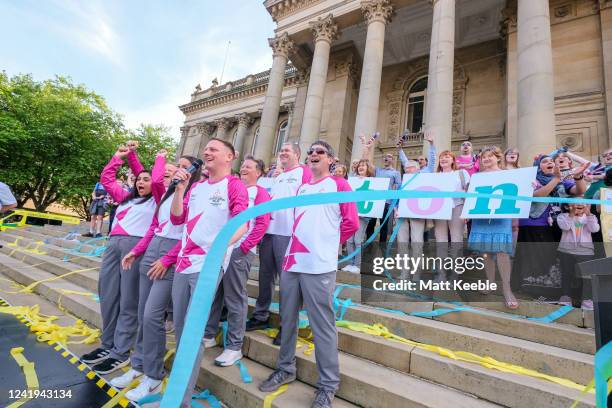 Antony Cotton and others take part in The Queen's Baton Relay as part of the Birmingham 2022 Queens Baton Relay on July 16, 2022 in Bolton, England....