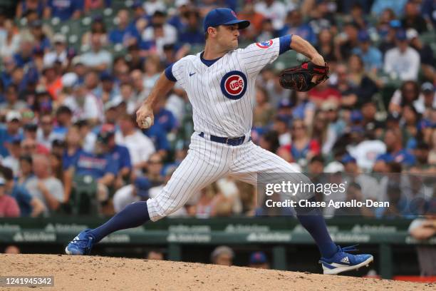 David Robertson of the Chicago Cubs pitches in the ninth inning during game one of a doubleheader against the New York Mets at Wrigley Field on July...