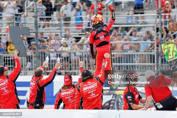 Justin Allgaier gives a fist pump to the crowd after winning the Xfinity Series Crayon 200 on July 16 at New Hampshire Motor Speedway in Loudon, New...