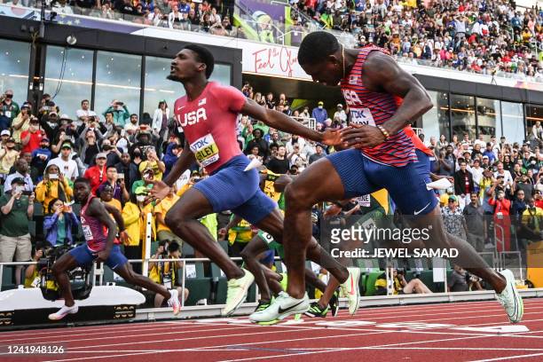 S Fred Kerley crosses the finish line ahead of compatriots Trayvon Bromell and Marvin Bracy to win the men's 100m final during the World Athletics...