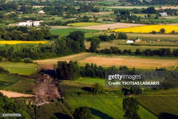 This picture taken on July 17, 2022 shows the crash site of an Antonov An-12 cargo aircraft a few kilometers away from the city of Kavala in Greece....