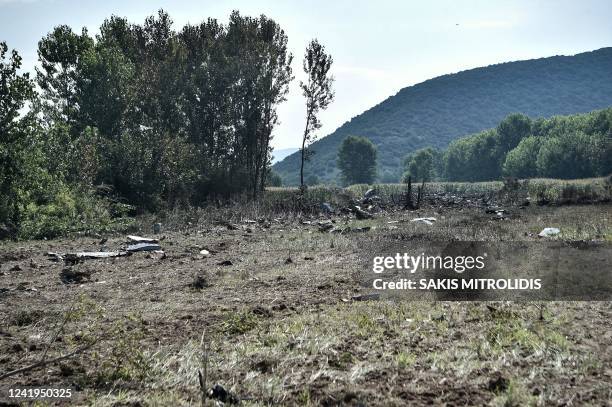 This picture taken on July 17 shows debris on the crash site of an Antonov An-12 cargo aircraft a few kilometres away from the city of Kavala in...