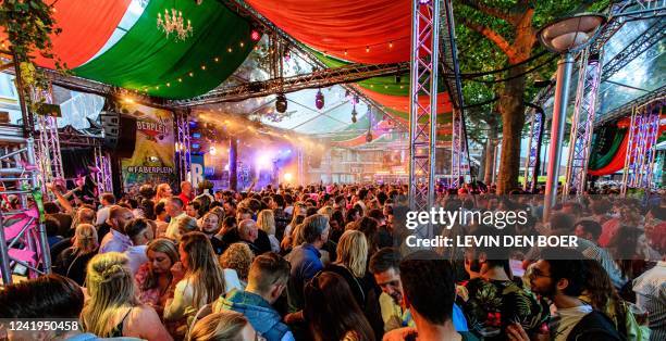 Spectators attend the Vierdaagsefeesten festival for its 104th edition after two years of absence due to the COVID-19 pandemic outbreak, in the...