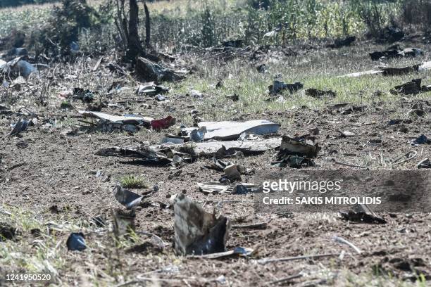This picture taken on July 17 shows debris on the crash site of an Antonov An-12 cargo aircraft a few kilometres away from the city of Kavala in...