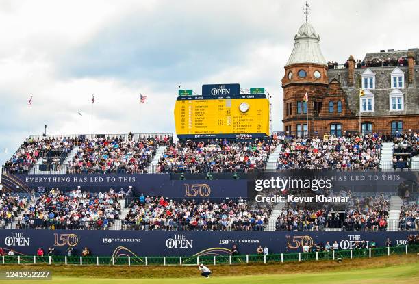 Fans watch from the grandstand as Tiger Woods putts on the 18th hole during the second round of The 150th Open Championship on The Old Course at St...