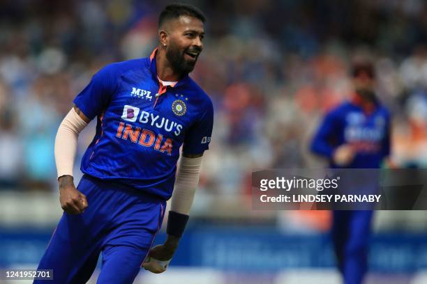 India's Hardik Pandya celebrates taking the wicket of of England's captain Ben Stokes for 27 runs during the final one-day international cricket...