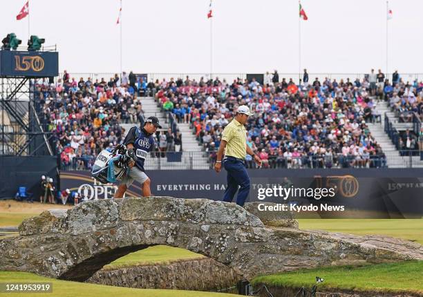 Hideki Matsuyama of Japan crosses the Swilcan Bridge on the 18th hole during the final round of the British Open golf championship on July 17 on the...