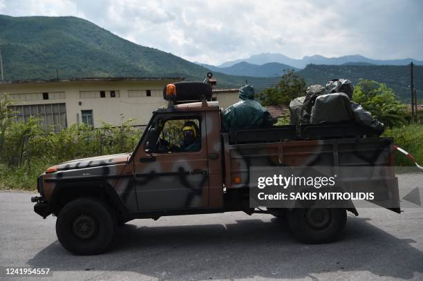 Picture shows an army vehicle transporting officers of Biochemic war on the way to the debris of the crash site of an Antonov An-12 cargo aircraft a...