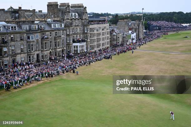 Australia's Cameron Smith collects his ball after making a birdie on the 18th green after his final round 64 on day 4 of The 150th British Open Golf...