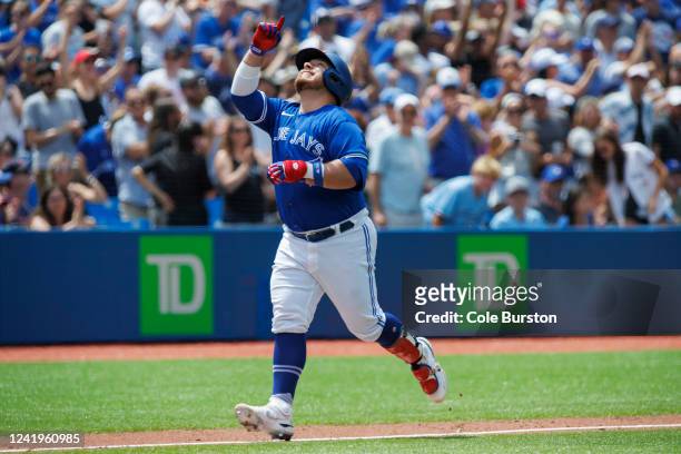 Alejandro Kirk of the Toronto Blue Jays runs out a two-run home run in the eighth inning of their MLB game against the Kansas City Royals at Rogers...