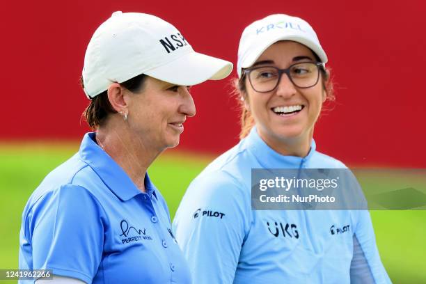 Teammates Marina Alex of the United States and Karrie Webb of Australia walk off the 18th green after completing the course during the final round of...