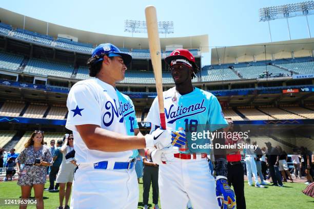 Diego Cartaya of the Los Angeles Dodgers and Elly De La Cruz of the Cincinnati Reds speak during batting practice prior to the 2022 SiriusXM All-Star...