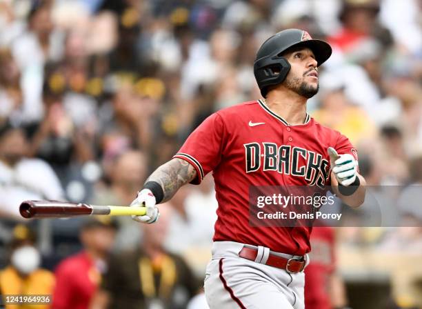 David Peralta of the Arizona Diamondbacks watches the flight of his solo home run during the sixth inning of a baseball game against the San Diego...