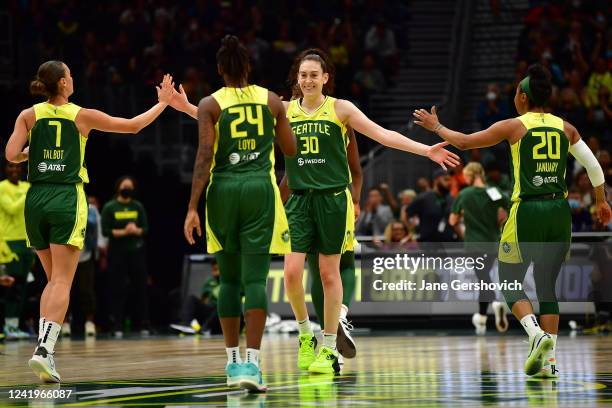 Breanna Stewart of the Seattle Storm high fives team mates during the game against the Indiana Fever on July 17, 2022 at the Climate Pledge Arena in...