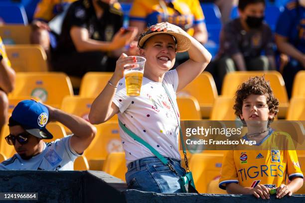 Fan of Tigres holds a beer prior the 3rd round match between Tigres UANL and Tijuana as part of the Torneo Apertura 2022 Liga MX at Universitario...
