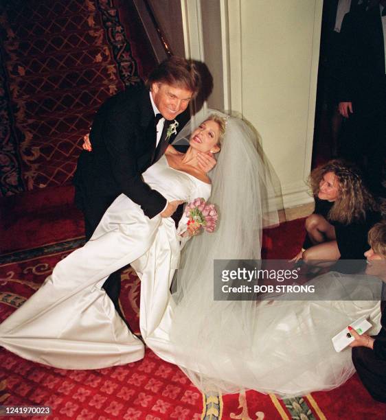 Donald Trump dips his new bride Marla Maples after couple married in a private ceremony at the Plaza Hotel, in New York, 20 December 1993, following...