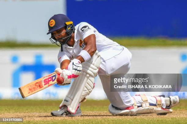 Sri Lanka's Dinesh Chandimal plays a shot during the third day of play of the first cricket Test match between Sri Lanka and Pakistan at the Galle...